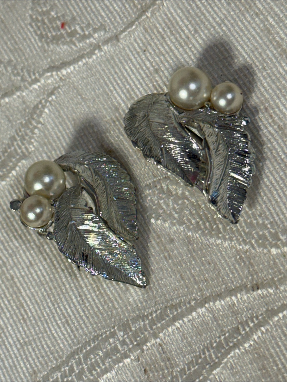 Vintage 1964 Sarah Coventry "Silvery Splendor" clip-on textured earrings.